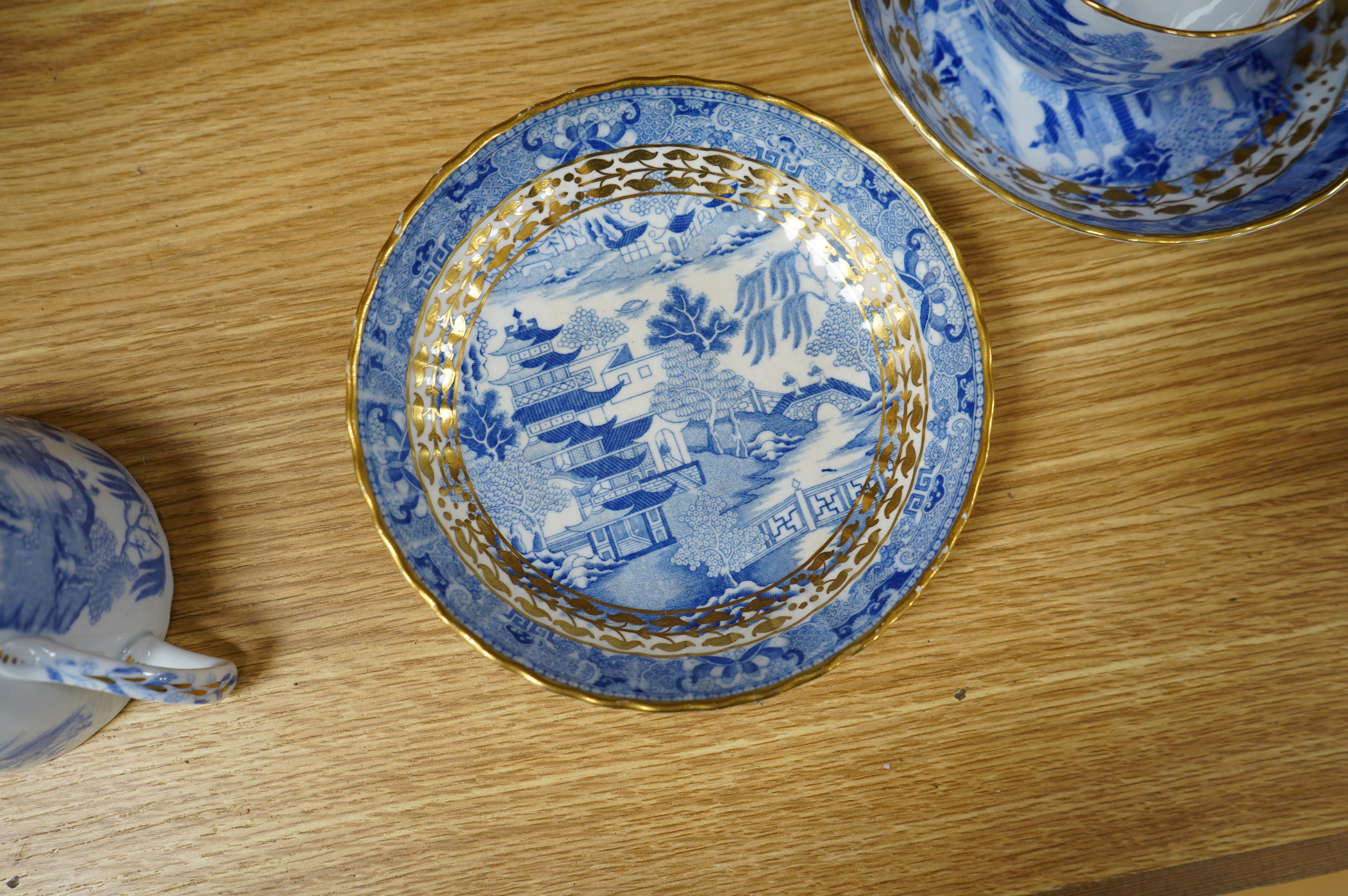 An early 19th century part coffee and tea set, probably Miles Mason, and a set of ten Derby dessert plates, 25cm in diameter. Condition - varies, poor to good